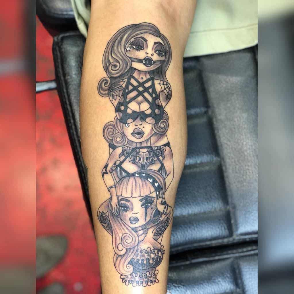 Stylized tattoo of three women stacked vertically, representing 'Hear No Evil, See No Evil, Speak No Evil,' with intricate details and accessories