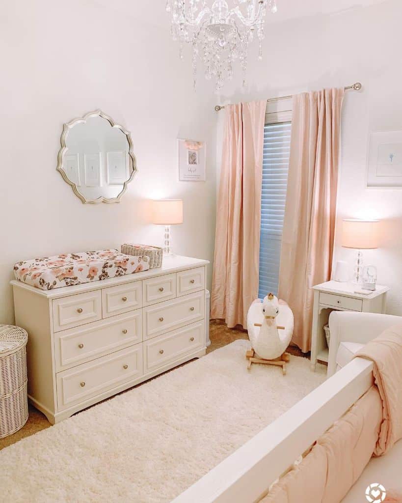 pink nursery white cabinet dresser wall mirror white crib
