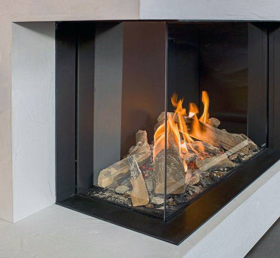Contemporary glass corner fireplace with black metal frame and realistic log design.