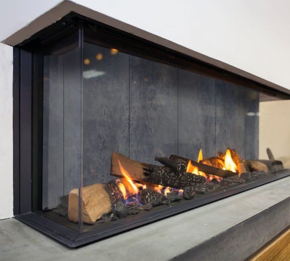 Glass-enclosed gas fireplace with realistic logs and sleek modern design.