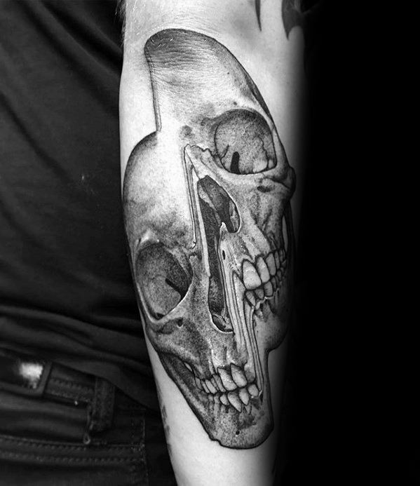 Realistic glitch tattoo of a human skull with vertical distortion, creating a split and melting visual effect along the center of the face