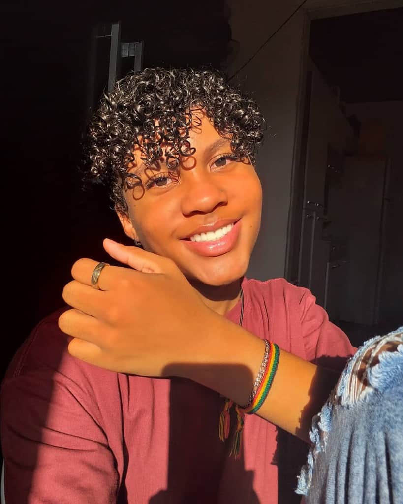 A sleek glossy curls with shoulder-length hair