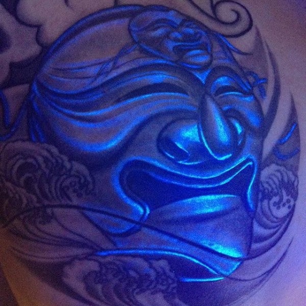 Glow In The Dark Tattoo Of Religous Face On Mans Chest
