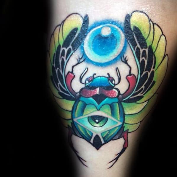 glowing eye scarab male thigh tattoo design ideas