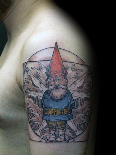 Tattoo of a gnome with a red hat and blue outfit, standing in front of a geometric background with swirling patterns on an upper arm.