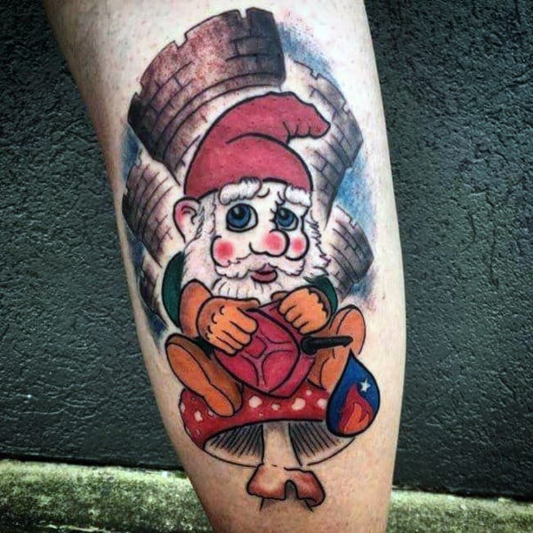 Tattoo of a cheerful gnome with a red hat, sitting on a mushroom, holding a shield and a heart, with a castle in the background.