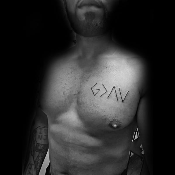 Chest tattoo featuring "God is greater than the highs and lows" symbol in bold black minimalist design