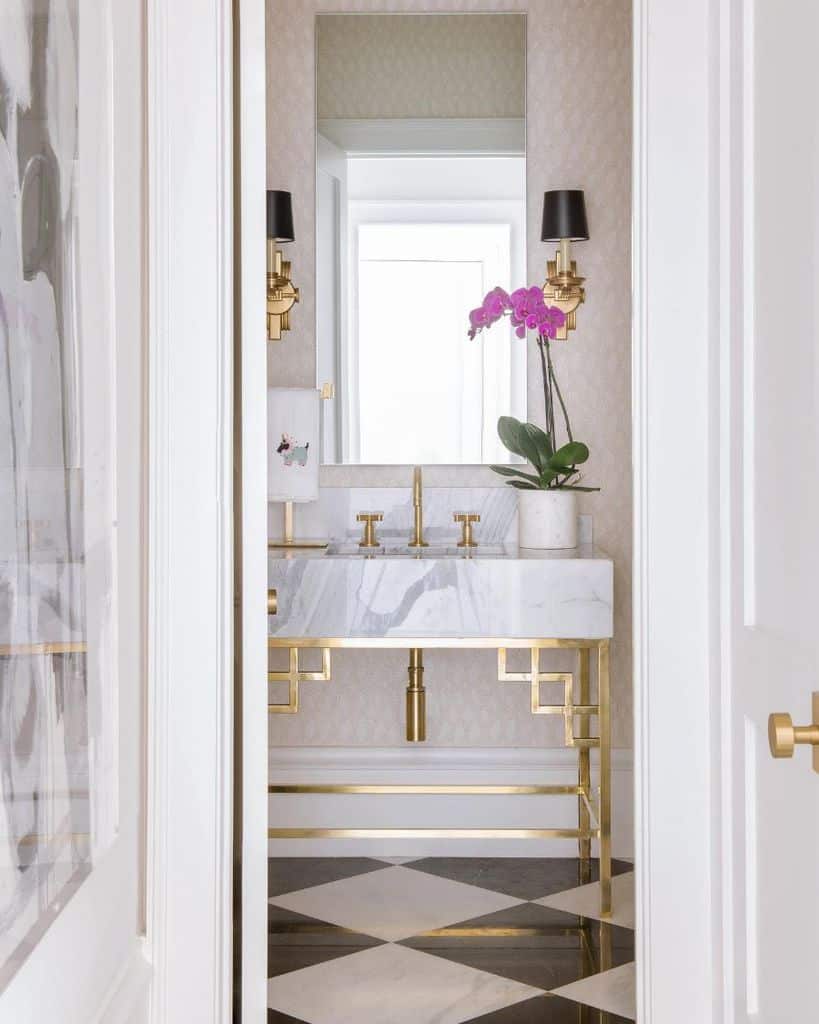 white marble bathroom with gold accents 