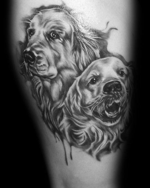 Realistic black and grey Golden Retriever tattoo featuring two expressive dog portraits with detailed fur shading and lifelike facial features.