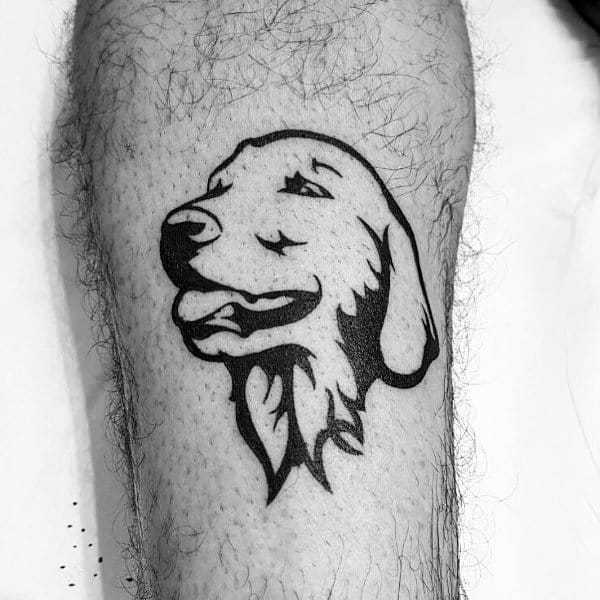 Bold black ink Golden Retriever tattoo on the leg, featuring a stylized design with thick outlines and minimal shading for a striking look.