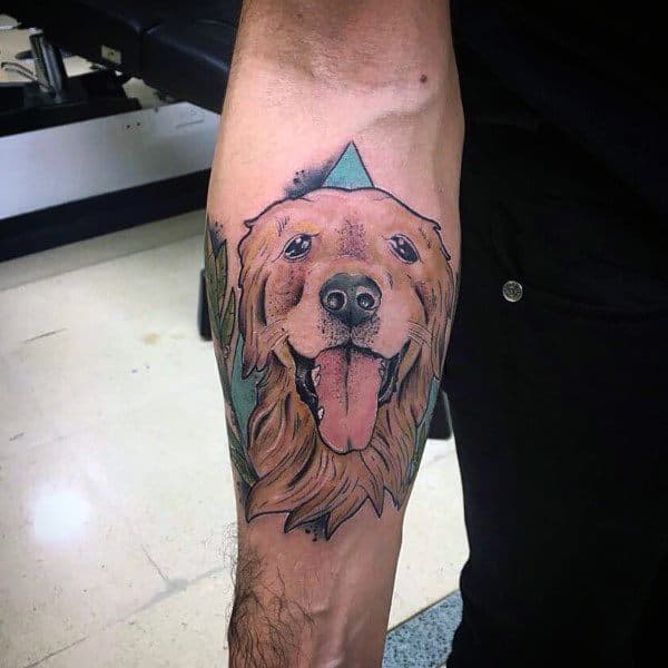 Colorful Golden Retriever tattoo on the forearm, featuring a happy expression, bold outlines, and a geometric background for a modern touch.