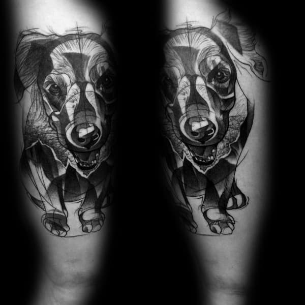 Abstract black and grey Golden Retriever tattoo on the forearm, featuring geometric elements, fine lines, and a dynamic, artistic composition.