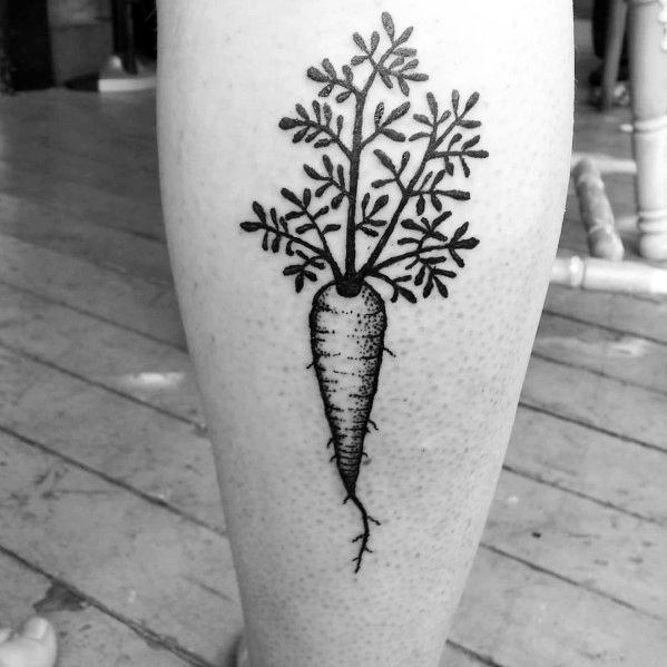 Minimalist black ink carrot tattoo on the calf, featuring fine line detailing and delicate leafy tops for a clean and elegant botanical design.