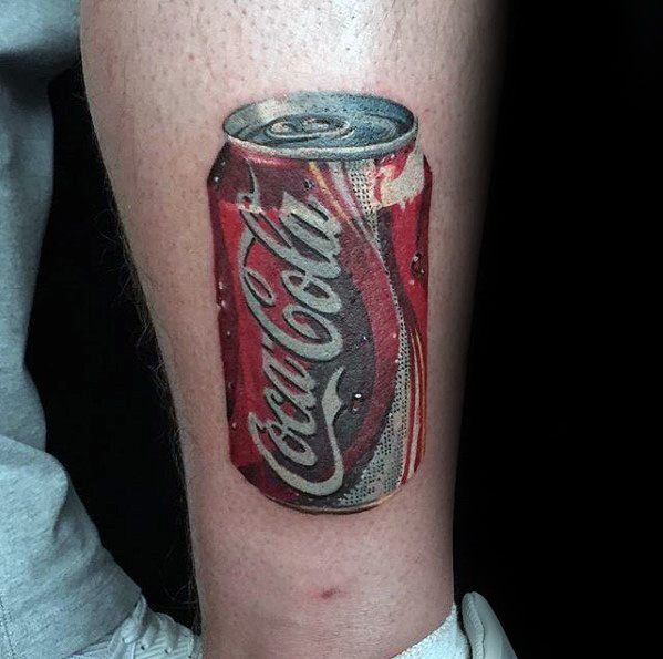 Hyper-realistic Coca-Cola can tattoo with detailed condensation, vibrant red tones, and a 3D effect for a lifelike and refreshing look.