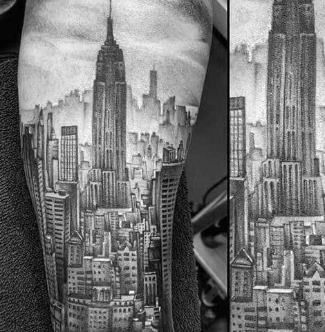 Empire State Building tattoo featuring an intricate NYC cityscape, detailed with subtle shading on a man's arm.