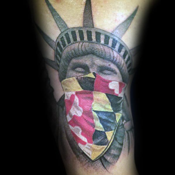 Statue of Liberty tattoo with a Maryland flag bandana covering the face, blending patriotic symbolism with a bold and unique design.