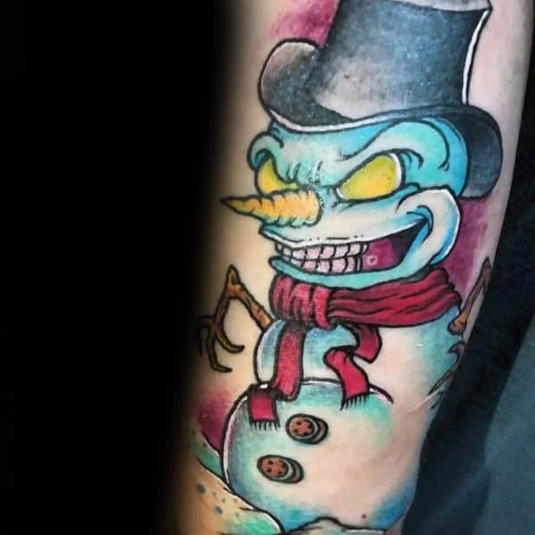 Evil snowman tattoo with glowing yellow eyes, a sinister grin, sharp twig arms, a top hat, and a red scarf, creating a chilling winter vibe.