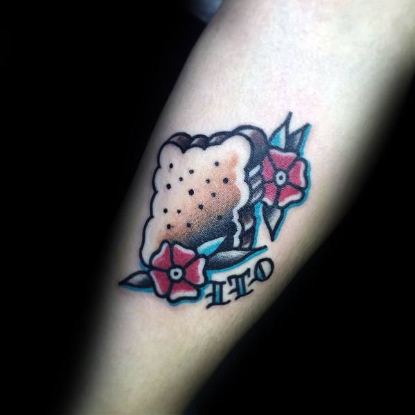 Classic tattoo-style s’mores design with bold outlines, decorative flowers, and the letters "LTO," blending nostalgia with traditional ink art.