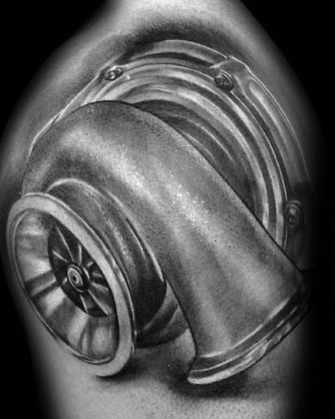 Realistic turbocharger tattoo on the upper arm with fine shading and intricate details, symbolizing speed, power, and a passion for automotive performance.