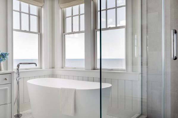 freestanding bathtub in bathroom with ocean view