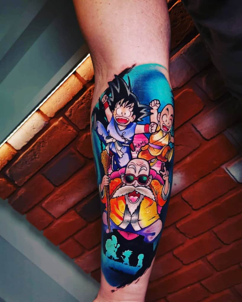A vibrant tattoo of Goku, Krillin, and Master Roshi from Dragon Ball, with the group jumping together against a colorful background.