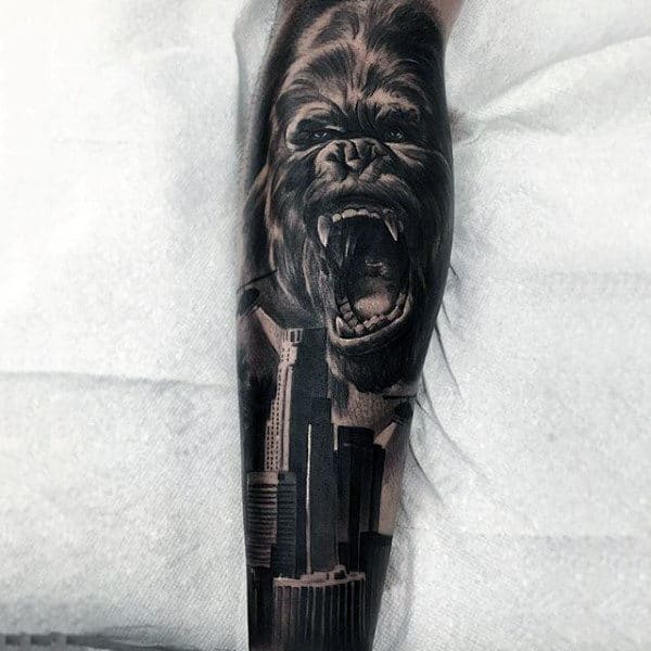 Gorilla City Skyline Forearm Sleeve Tattoo On Man