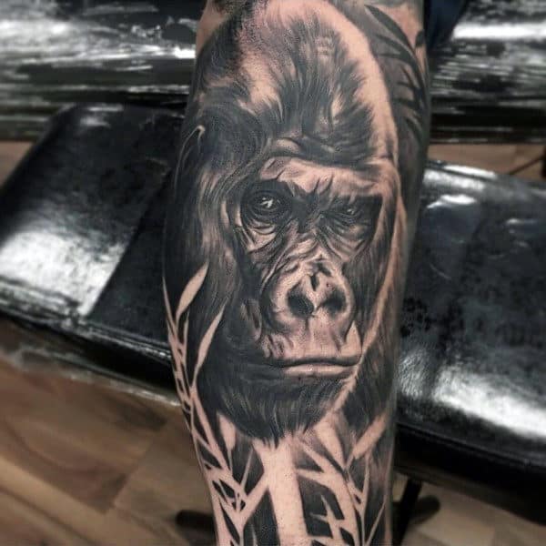 Gorilla Mens Tattoo In Woods On Mans Leg