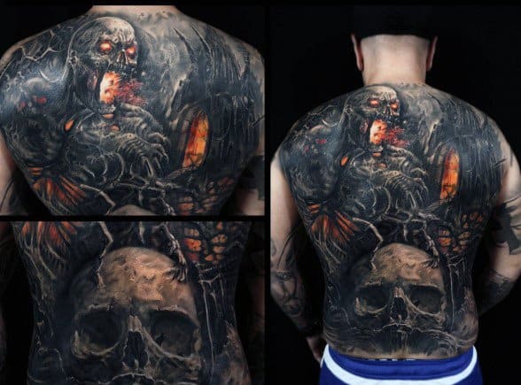 Dark gothic full-back tattoo featuring a fiery-eyed skeletal creature, a large skull, and haunting details in black, grey, and glowing orange tones.