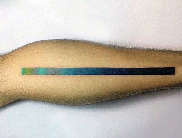 Minimalist tattoo featuring a gradient color bar on the leg, transitioning smoothly between shades for a sleek and modern design.