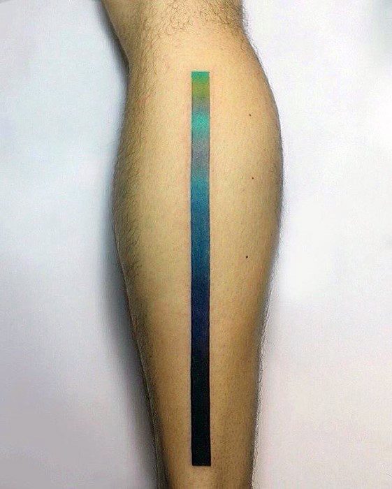 Minimalist gradient tattoo of a long vertical line transitioning from green to blue to black, placed along the side of the calf.