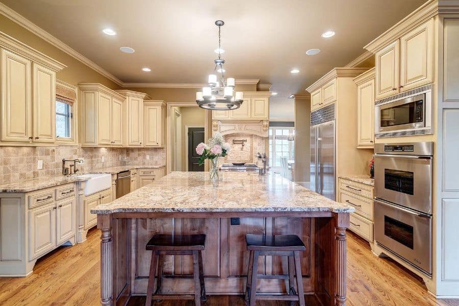 large elegant country kitchen white cabinets huge granite countertop island