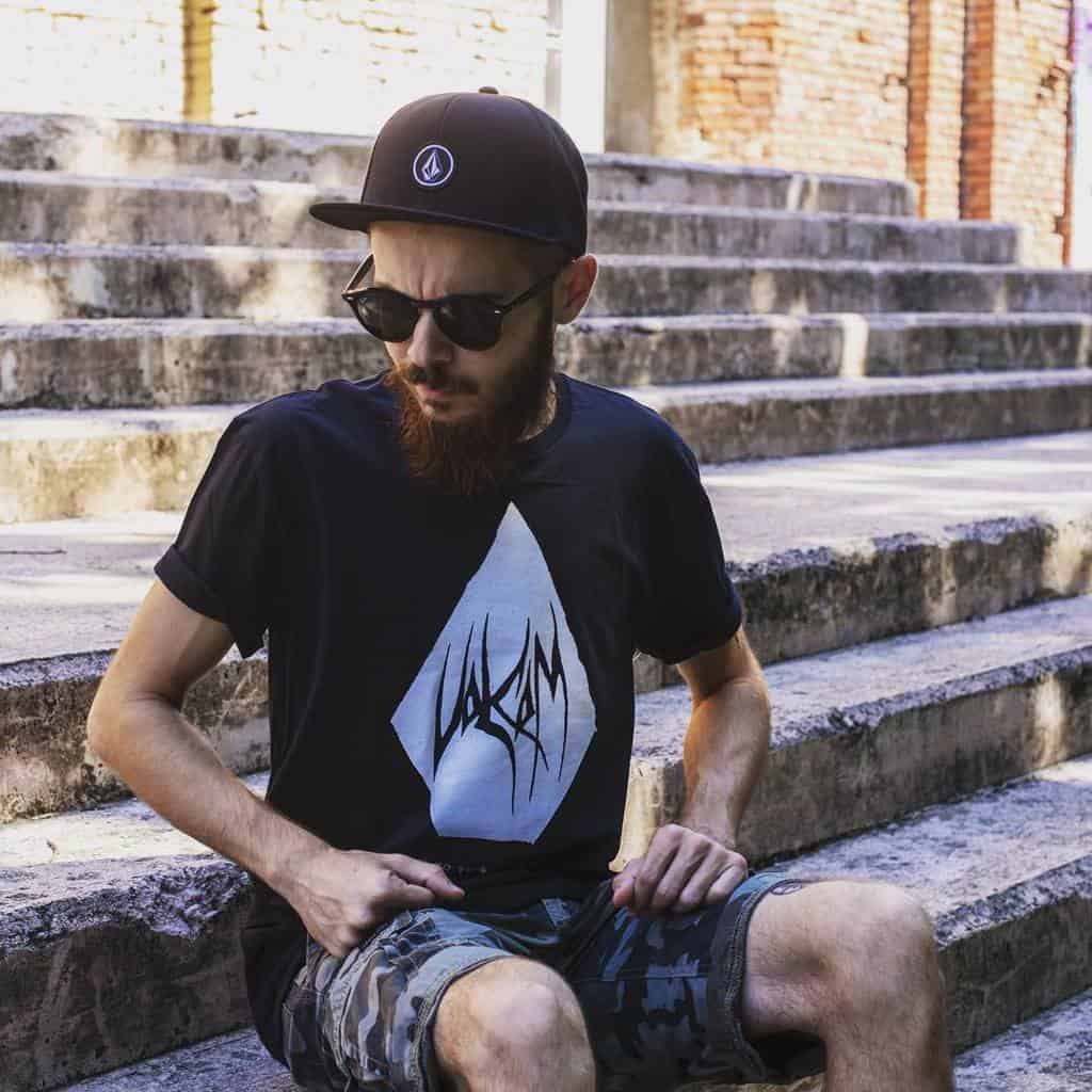 The back of someone wearing a surf shop logo hoodie