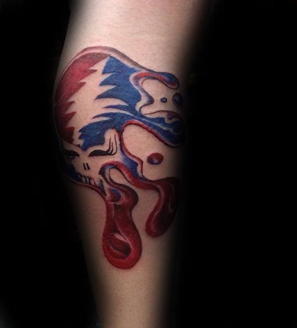 Grateful Dead Steal Your Face skull tattoo with a melting effect in red and blue, creating a bold and psychedelic look.