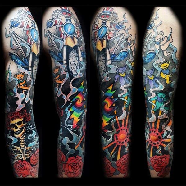 Grateful Dead full sleeve tattoo featuring dancing bears, skull with roses, psychedelic swirls, and iconic band imagery throughout.