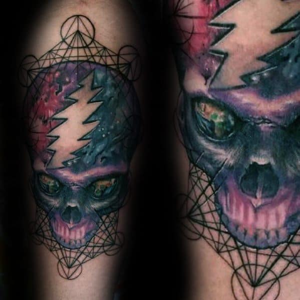 Grateful Dead Steal Your Face skull tattoo with a cosmic galaxy design, vivid lightning bolt, and geometric pattern framing the skull.