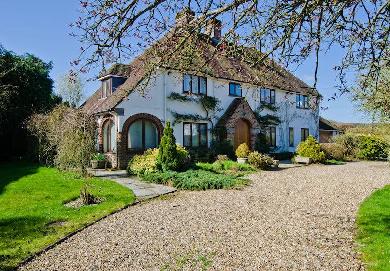 gravel driveway country style home