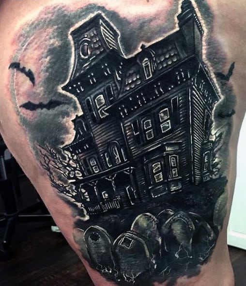 Tattoo of a haunted mansion with an eerie graveyard and bats in dark, gothic style