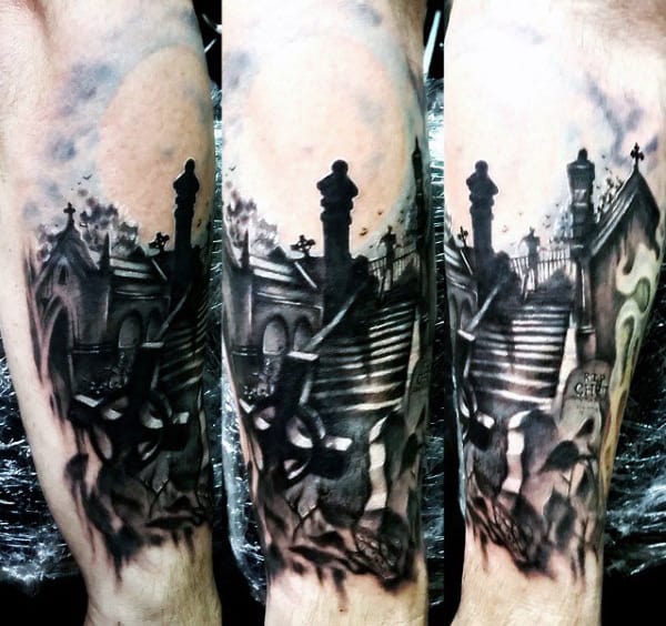 Tattoo of a graveyard with steps, crosses, and Gothic elements