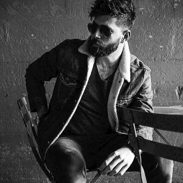 undercut hair style with medium beard