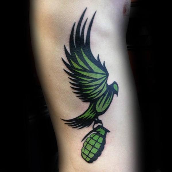 Green Tribal Bird Flying With Grenade Mens Rib Cage Side Tattoo