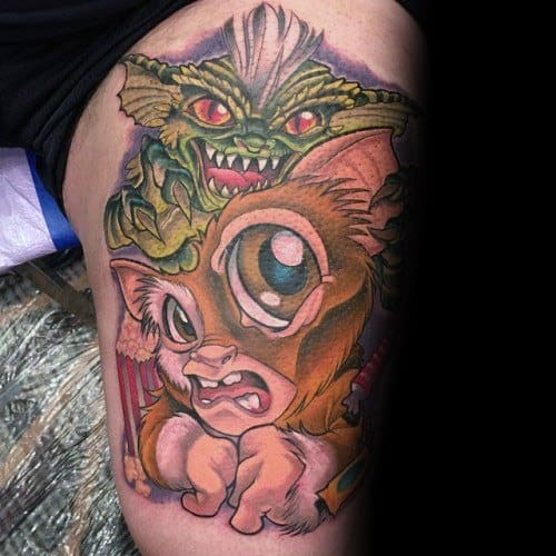 Gremlin and Gizmo tattoo with a fierce green Gremlin looming over a wide-eyed, cartoonish Gizmo, blending horror and cuteness.