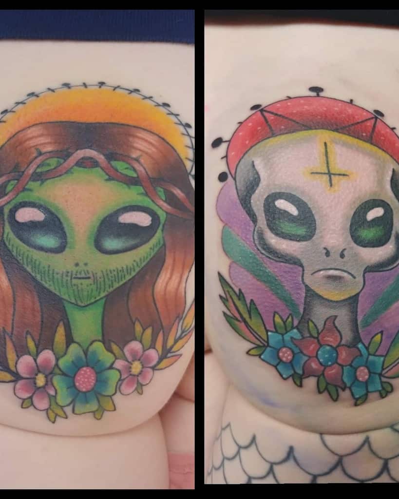 Two colorful alien-themed tattoos, one resembling Jesus with a halo and crown of thorns, the other with a sacred look and a cross.