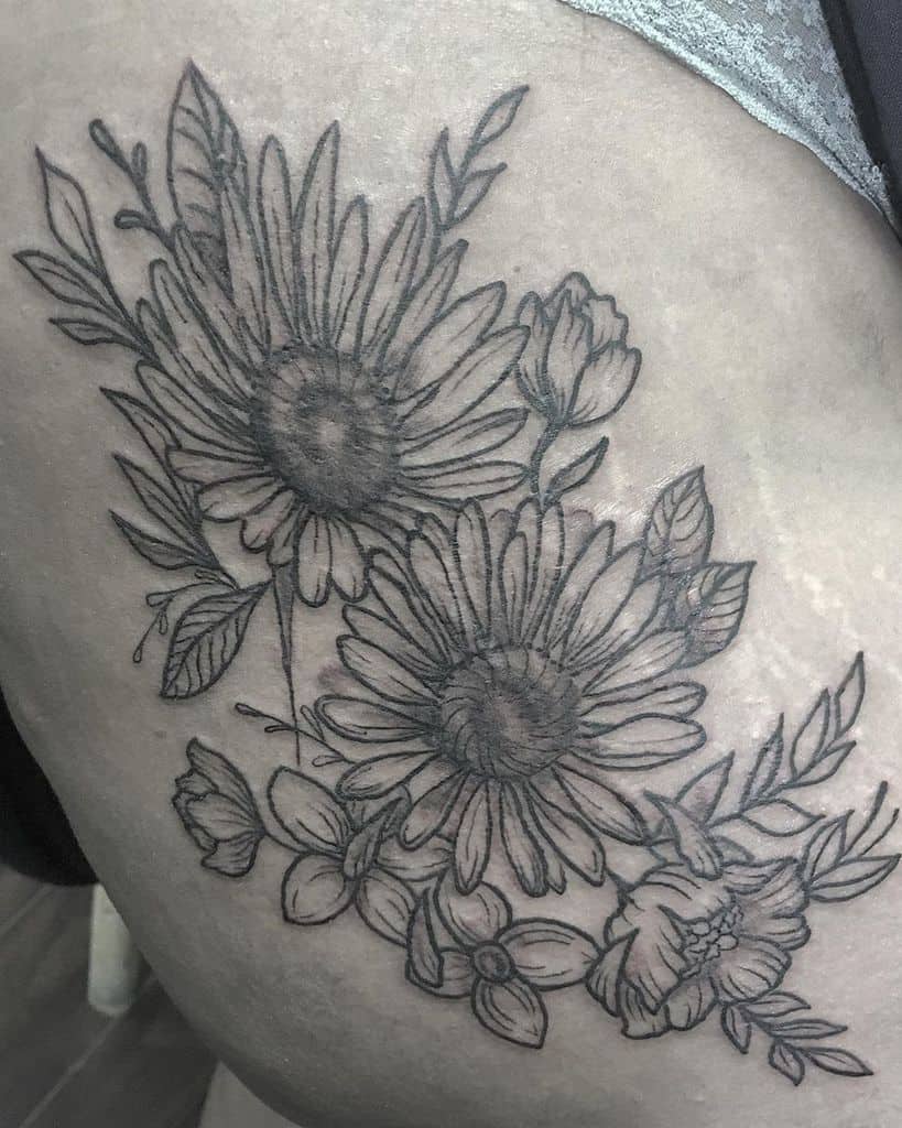Thigh tattoo black and grey daisy flower bouquet