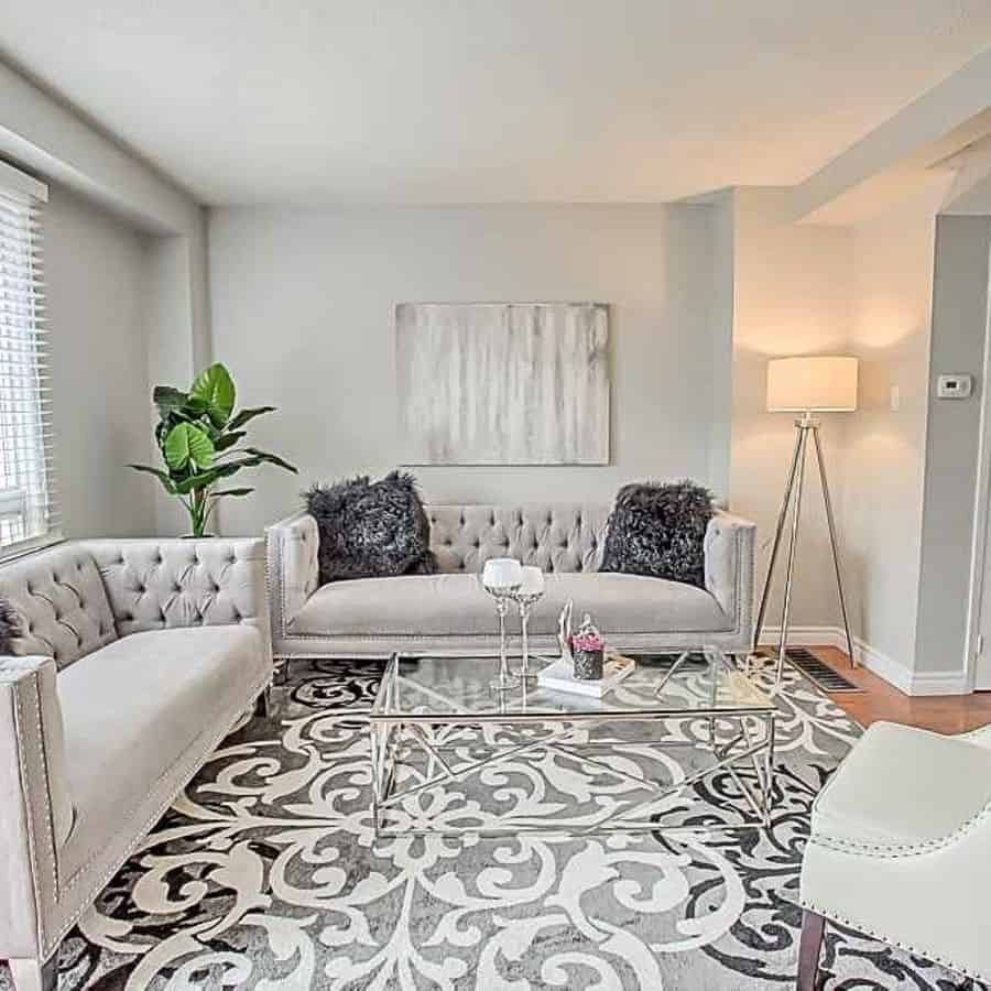 white family room gray couch lamp plant glass tabletop 