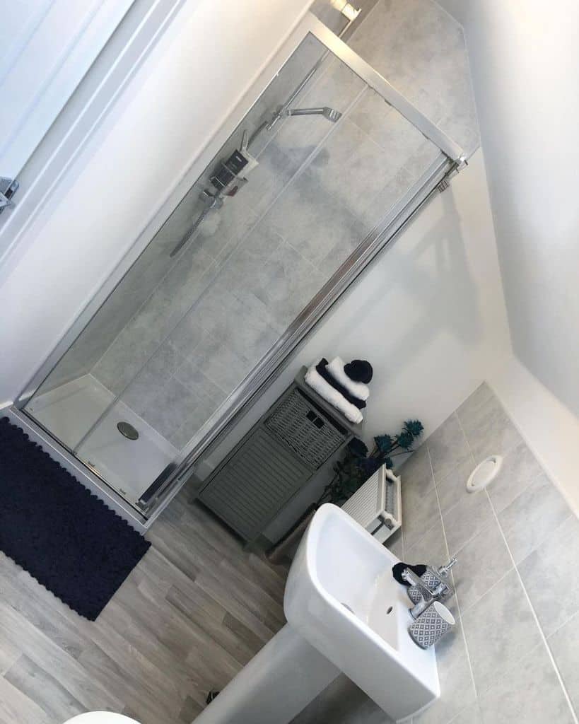 gray tile small shower in bathroom