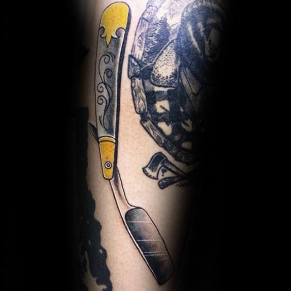 Grey Straight Razor With Yellow Pattern Tattoo Male Forearms