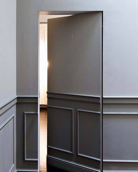 two tone gray and white walls hidden door