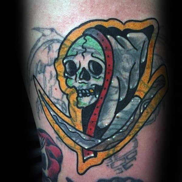 Blast over tattoo of a grim reaper with a green skull and scythe