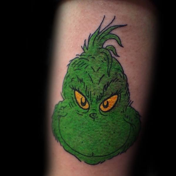 Colorful Grinch character with green fur and yellow eyes, capturing his mischievous expression in a bold and playful tattoo design.