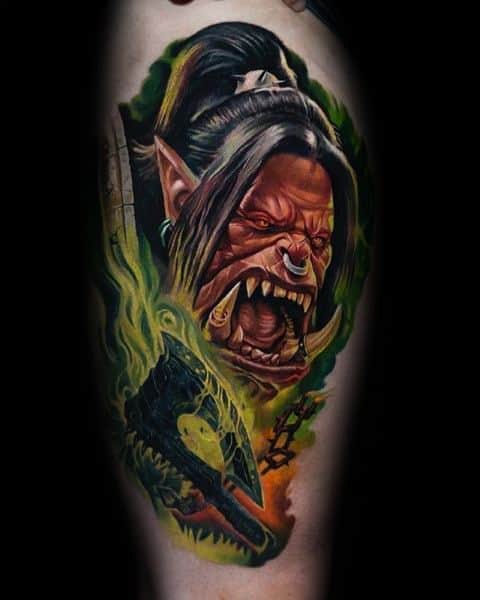 Realistic tattoo of a fierce orc from World of Warcraft, featuring glowing green energy, sharp tusks, and intense expression, inked with vibrant colors.